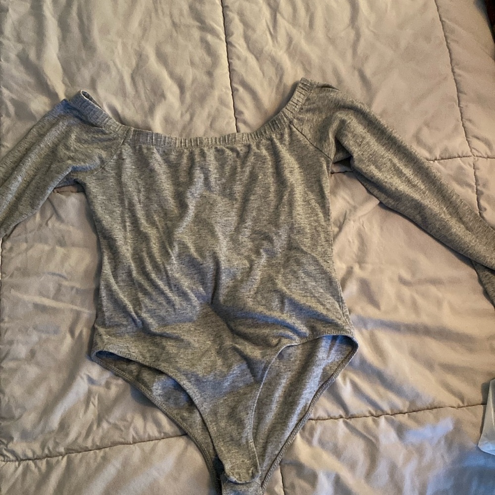 Small grey off the shoulder long sleeve body suit.